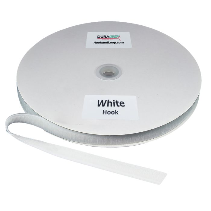 A roll of white DURAGRIP brand hook fastener material on a circular white cardboard spool, with a loose end of the tape extending forward.