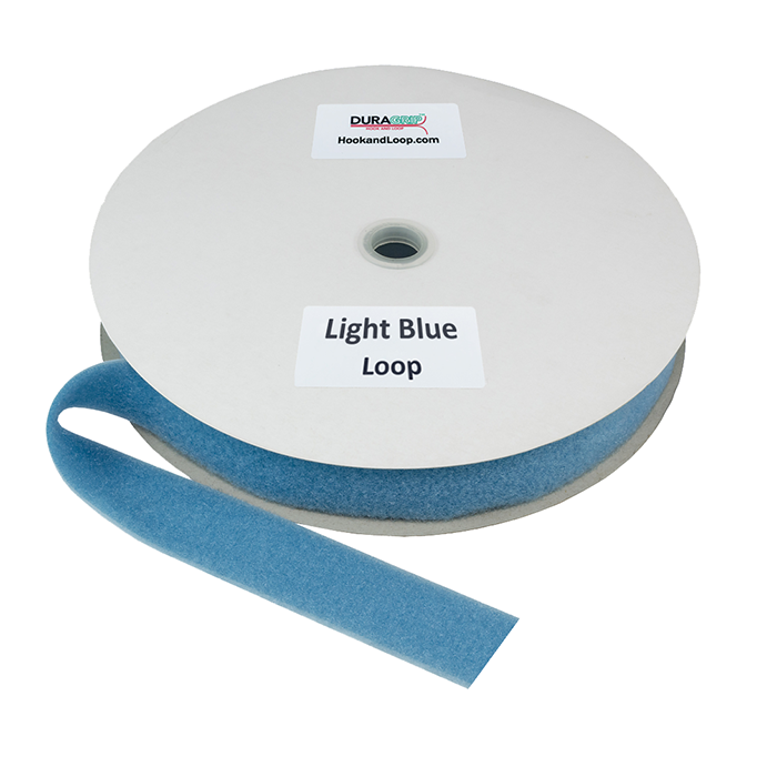 A roll of light blue DURAGRIP brand loop fastener material on a circular white cardboard spool, with a loose end of the tape extending forward.